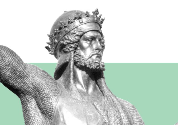 A statue in a pose that symbolizes the king archetype